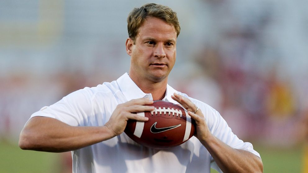 Southern California coach Lane Kiffin watches his team warm up before the first half of an NCAA college football game against Washington State in Los Angeles, Saturday, Sept. 7, 2013. 