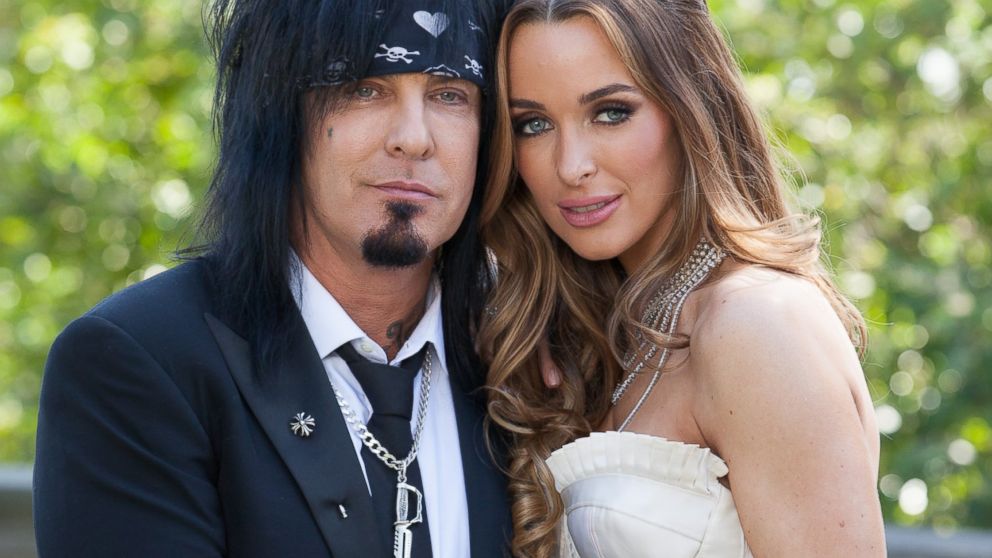 Nikki Sixx, left and Courtney Bingham pose for portraits during their wedding at Greystone Mansion, March 15, 2014 in Beverly Hills, Calif.   