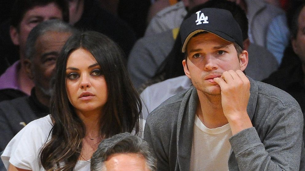 Mila Kunis and Ashton Kutcher attend a basketball game between the Phoenix Suns and the Los Angeles Lakers at Staples Center, Feb. 12, 2013, in Los Angeles.