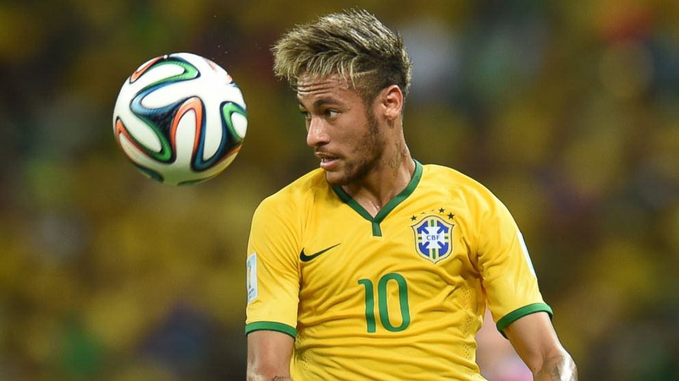 PHOTO: Brazil's forward Neymar eyes the ball during the quarter-final match between Brazil and Colombia during the 2014 FIFA World Cup in Fortaleza, Brazil on July 4, 2014. 