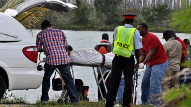 PHOTO: Police recover the bodies of the four occupants of a single-engine plane that crashed in the water soon after taking off from Grand Bahama islands airport, Nov. 10, 2013.