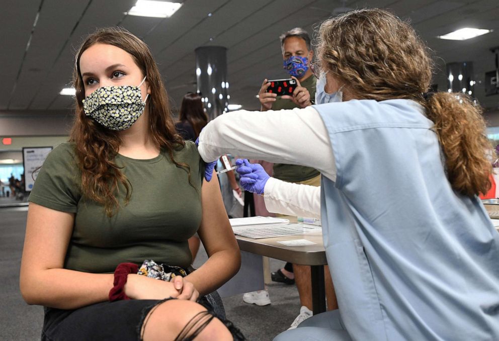 PHOTO: In this May 17, 2021, file photo, a nurse gives a 15-year-old a shot of the vaccine at a vaccination clinic at Health First Medical Centre in Melbourne, Fla.