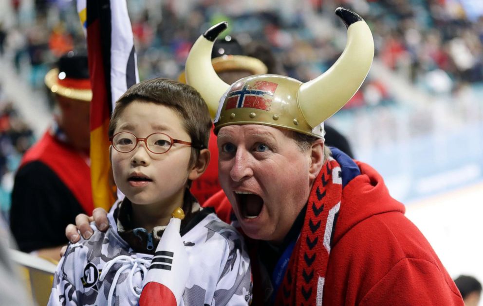 PHOTO: A Norwegian hockey fan poses with a South Korean boy when both attended a hockey match, Feb. 18, 2018. 