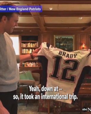 New England Patriots owner Robert Kraft presents Tom Brady with his stolen Super Bowl jerseys. 