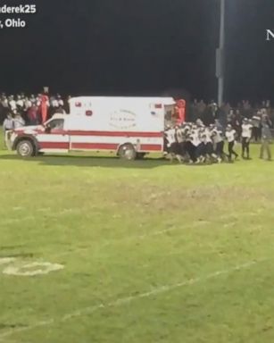 After it turned out an ambulance wasn't needed at this high school football game, it took an entire team to push it off the field.