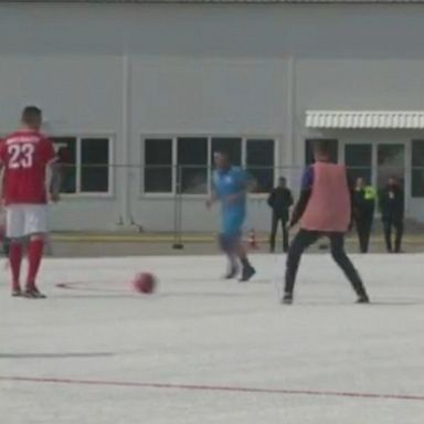 A new soccer arena in Sochi, Russia is red-and-white instead of traditional green - made up of more than 2.5 tons of recycled plastic from last year's World Cup.