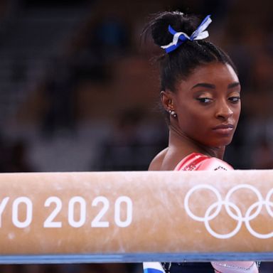 Simone Biles returns to competition and wins bronze in individual balance beam. 