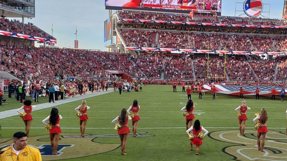 PHOTO: A San Francisco 49ers cheerleader is seen kneeling during the national anthem ahead of the team's game against the Oakland Raiders on Nov. 1, 2018.