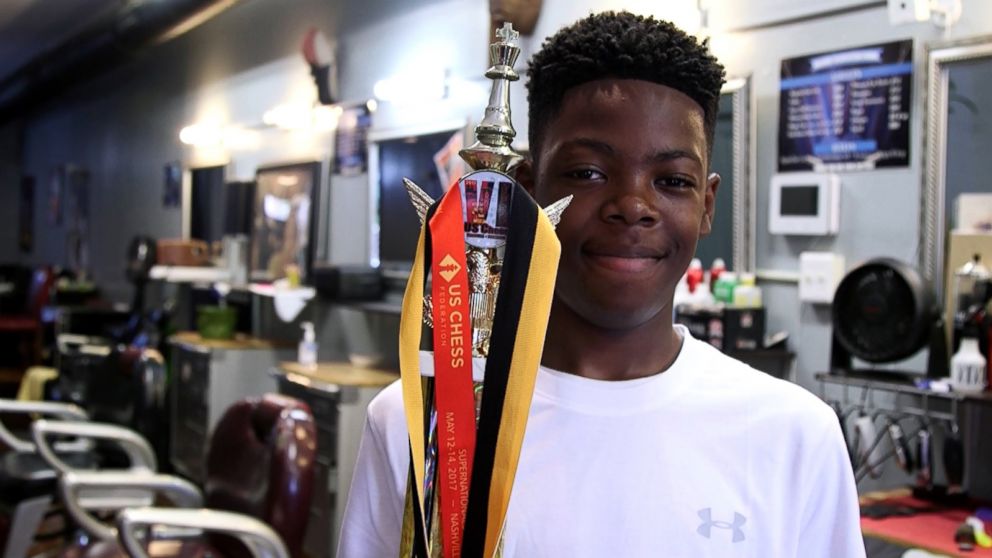 PHOTO: Cahree Myrick, 12, poses with his first place trophy in Reflection Eternal Barbershop in Baltimore, MD. 