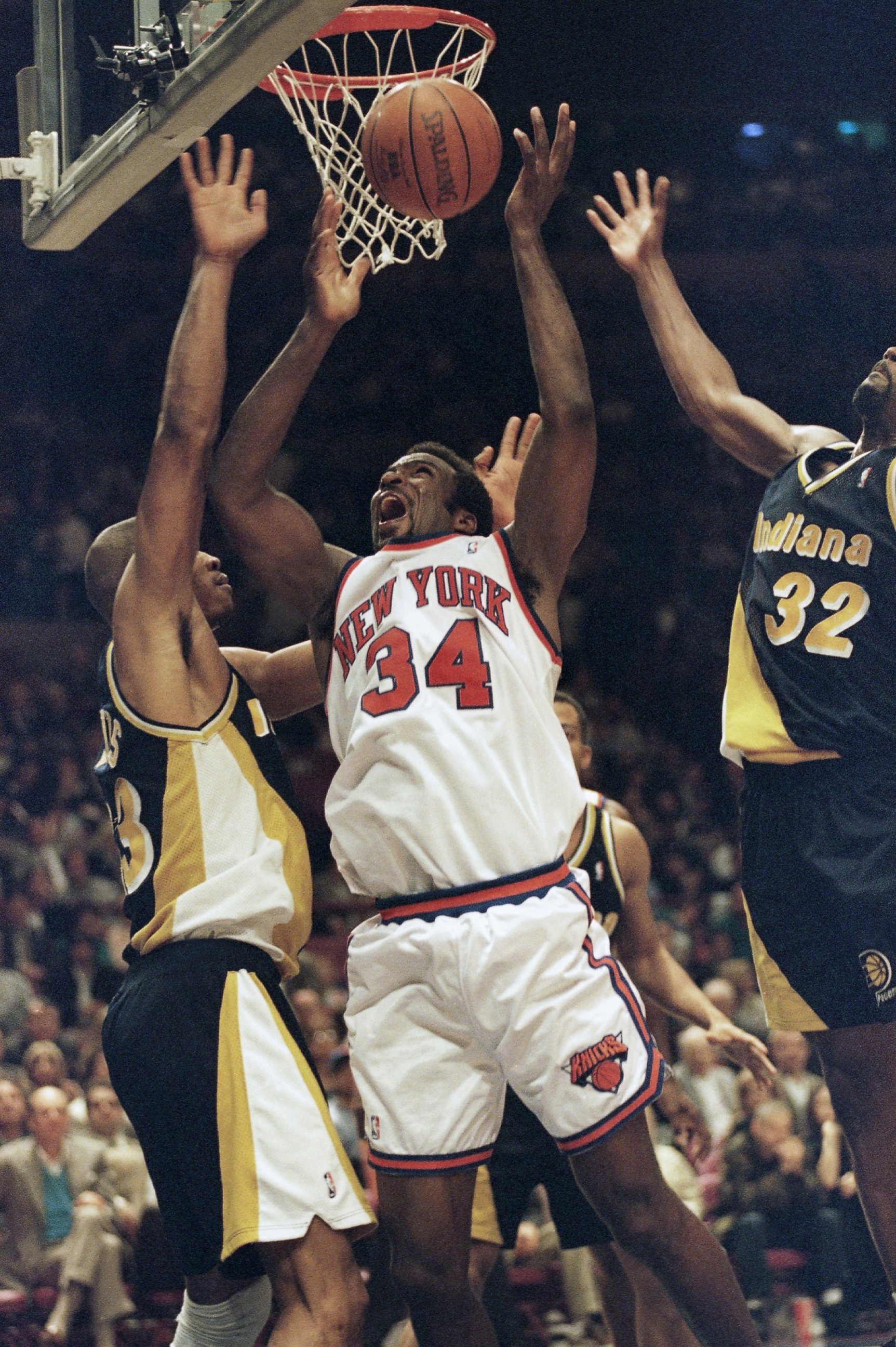 PHOTO: New York Knicks forward Charles Oakley, right, grabs a rebound over Indiana Pacers Antonio Davis in the second half of their Eastern Conference semifinal game in New York?s Madison Square Garden on Tuesday, May 9, 1995.