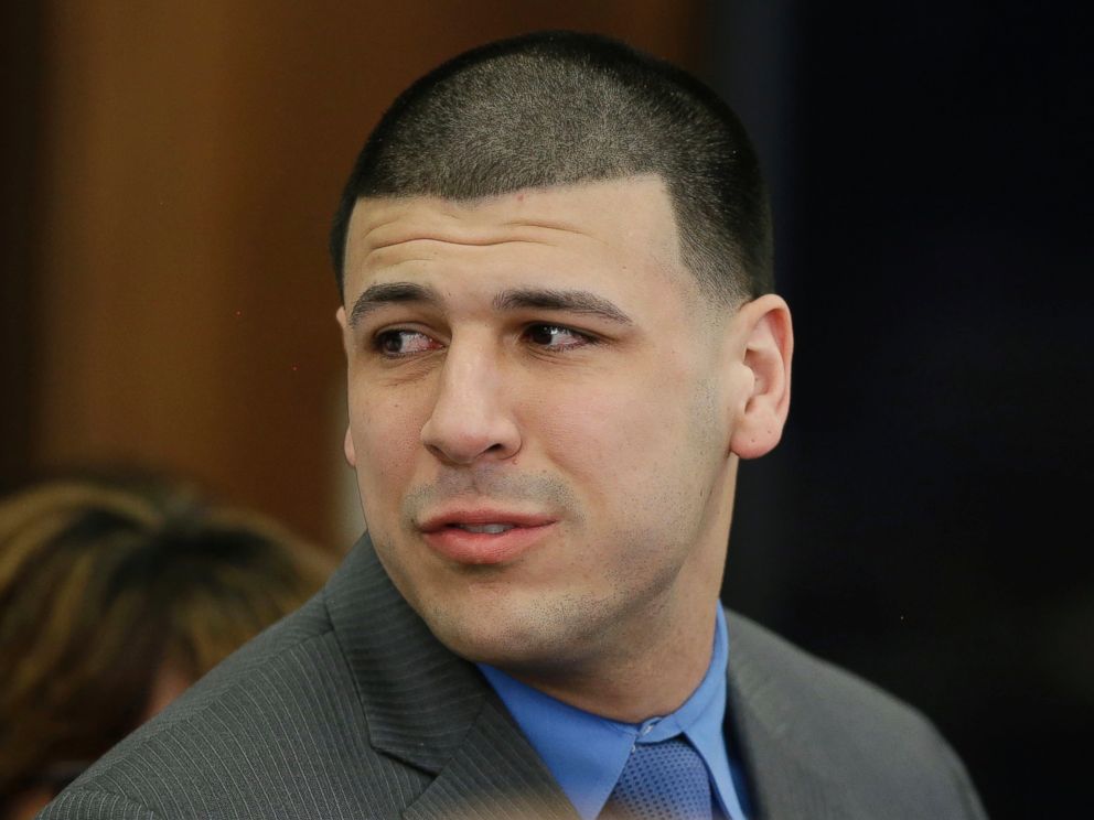 PHOTO: Aaron Hernandez turns to look toward his fiancee Shayanna Jenkins Hernandez as he reacts to his double murder acquittal at Suffolk Superior Court, April 14, 2017, in Boston.