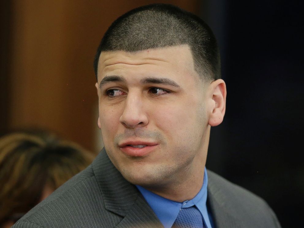 PHOTO: Aaron Hernandez turns to look toward his fiancee Shayanna Jenkins Hernandez as he reacts to his double murder acquittal at Suffolk Superior Court, April 14, 2017, in Boston. 