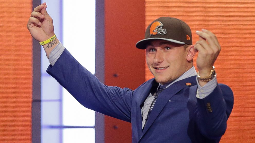 Texas A&M quarterback Johnny Manziel reacts after being selected by the Cleveland Browns as the 22nd pick in the first round of the 2014 NFL Draft, May 8, 2014, in New York.