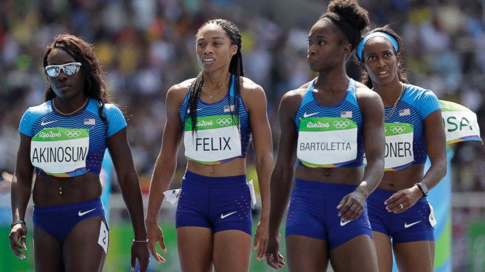 From left, members of the United States 4x100-meter relay team: Morolake Akinosun, Allyson Felix, Tianna Bartoletta and English Gardner walk to the finish after dropping the baton during the Summer Olympics in Rio de Janeiro, Aug. 18, 2016.
