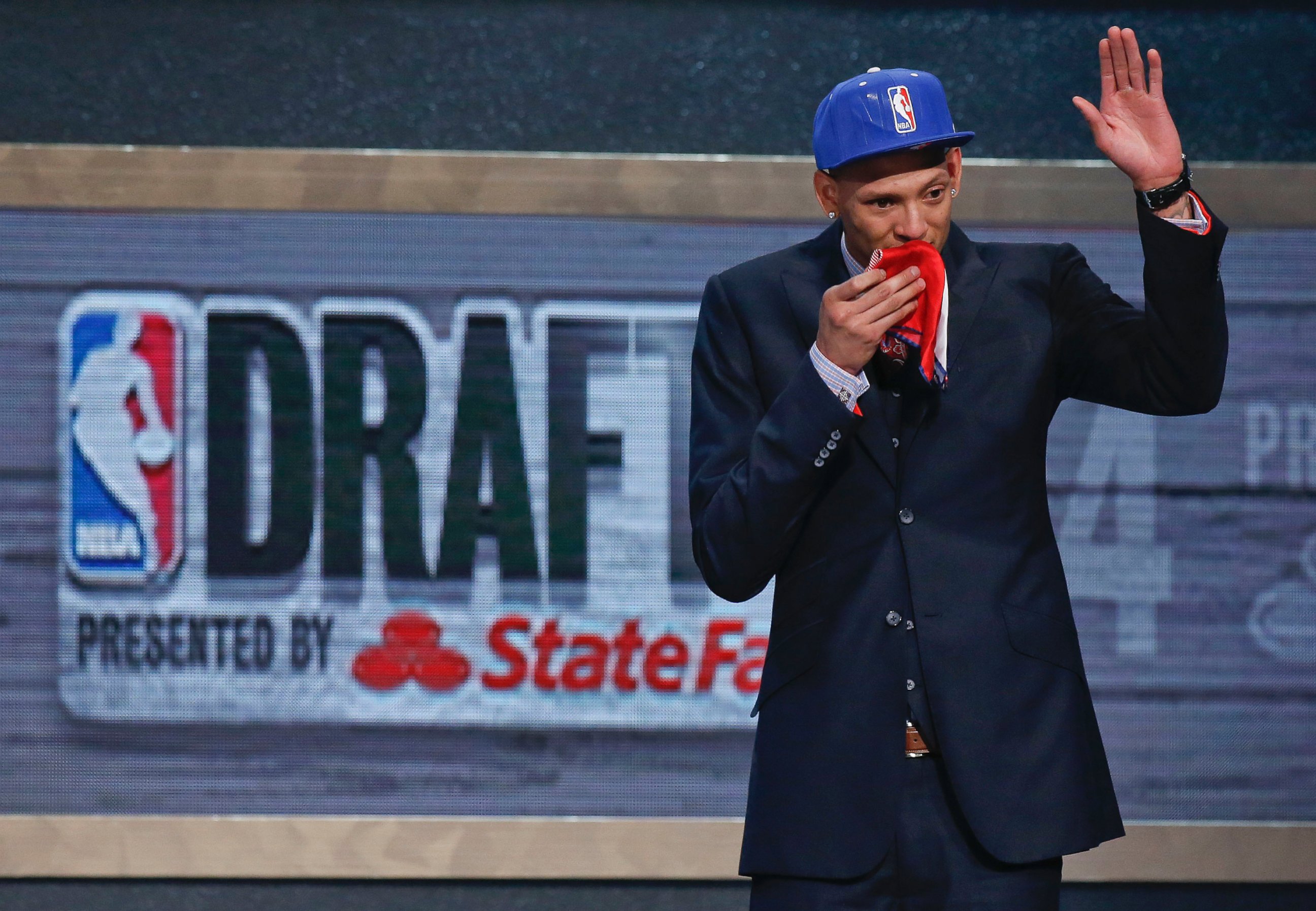 PHOTO: Baylor center Isaiah Austin waves to the crowd after being granted a ceremonial first round pick during the 2014 NBA Draft, June 26, 2014, in New York.