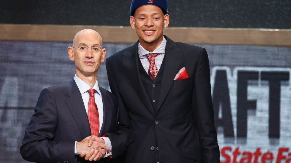 PHOTO: Baylor center Isaiah Austin, right, poses for a photo with NBA Commissioner Adam Silver after being granted a ceremonial first round pick during the 2014 NBA draft, June 26, 2014, in New York.