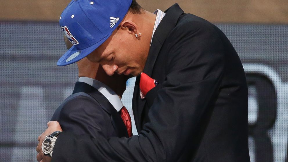 PHOTO: Baylor center Isaiah Austin, right, hugs NBA Commissioner Adam Silver after being granted a ceremonial first round pick during the 2014 NBA draft, June 26, 2014, in New York.
