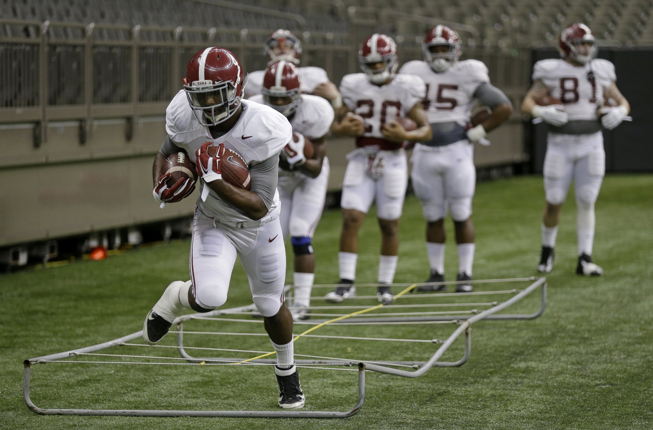 Alabama running back T.J. Yeldon (4) goes through drills during NCAA college football practice at the Mercedes-Benz Superdome in New Orleans, La., Sunday, Dec. 28, 2014. Alabama is scheduled to play Ohio State in the Sugar Bowl on Jan. 1, 2015.