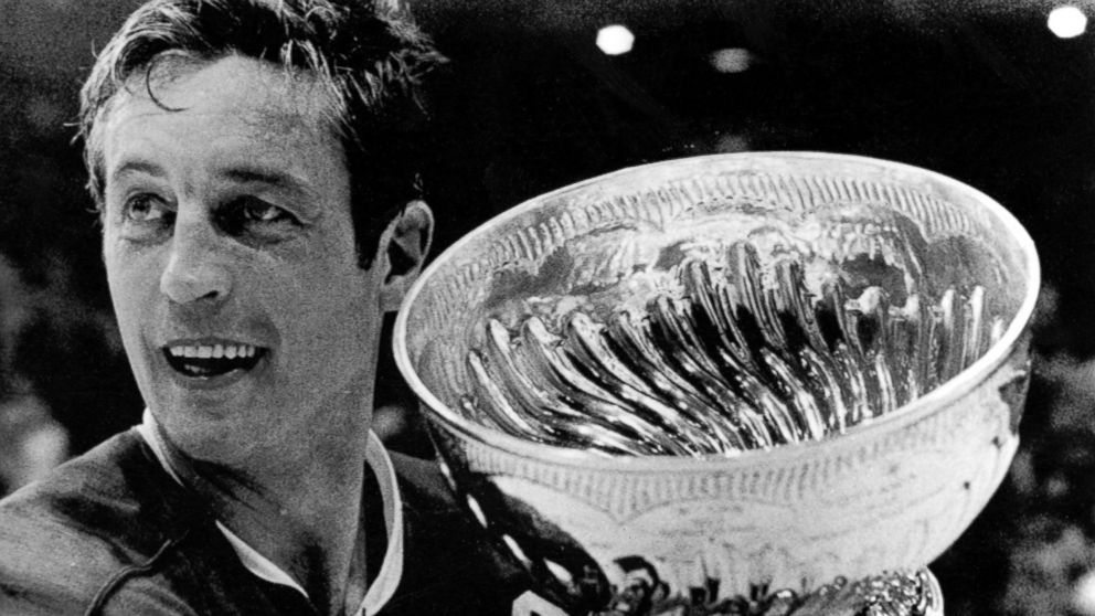 Montreal Canadiens team captain Jean Beliveau holds the Stanley Cup in Chicago following the Canadiens 3-2 victory over the Chicago Blackhawks, May 19, 1971.