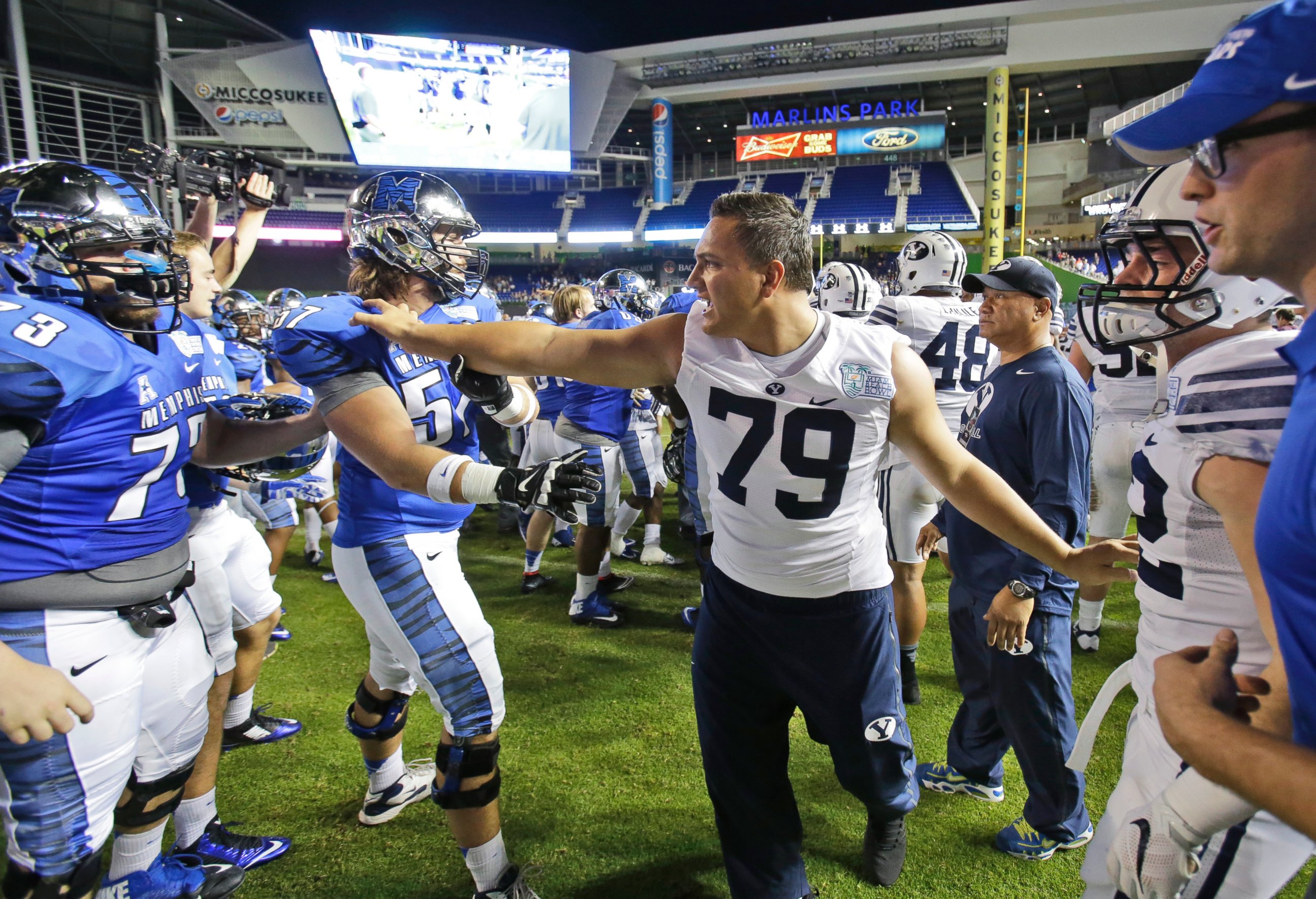 PHOTO: BYU's Latanoa Pikula intercedes in a brawl after Memphis defeated BYU Young 55-48 in two overtimes in the inaugural Miami Beach Bowl NCAA college football game, Dec. 22, 2014, in Miami.
