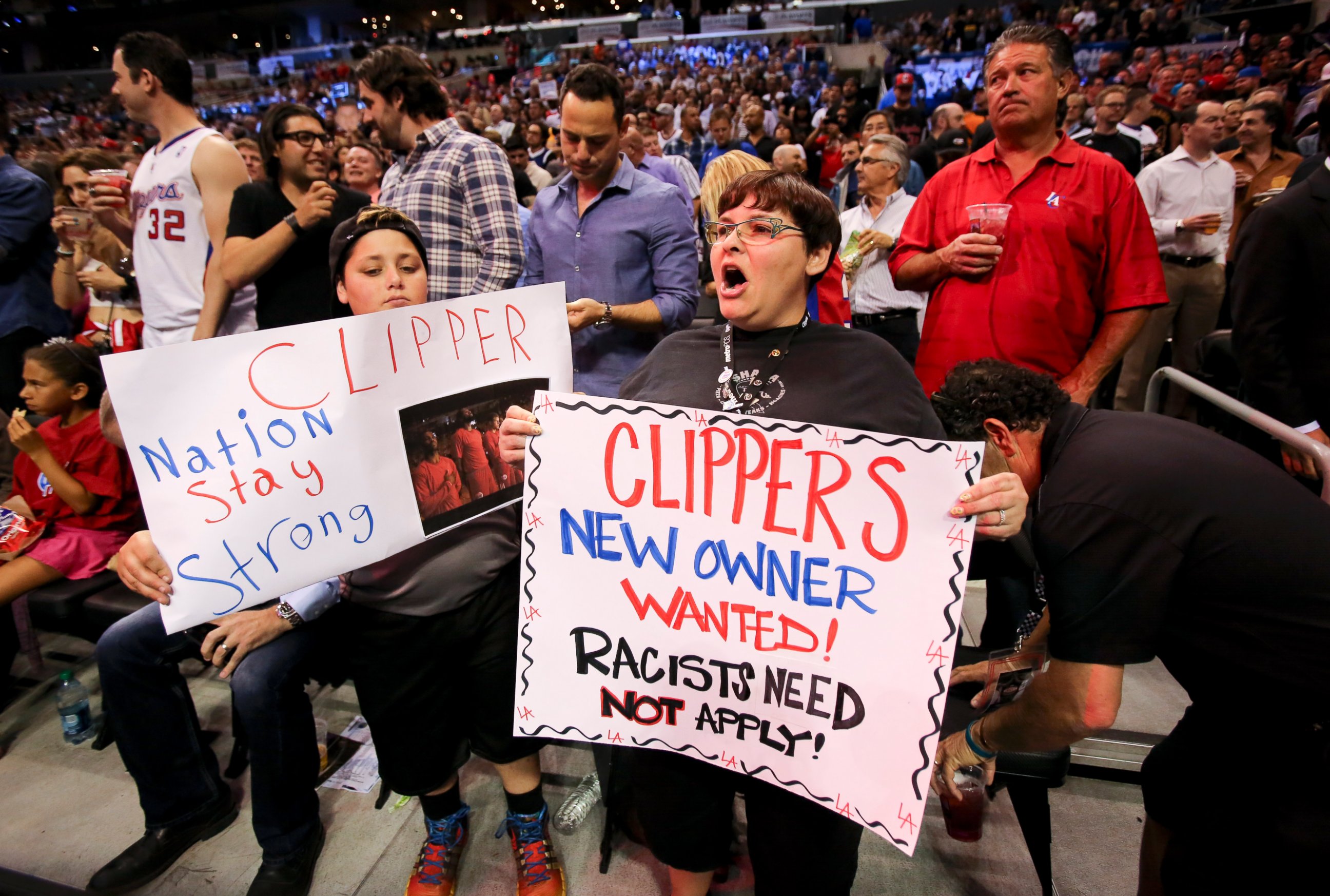PHOTO: Fans hold up signs in support of the Los Angeles Clippers before Game 5 of an opening-round NBA basketball playoff series between the Clippers and the Golden State Warriors, Tuesday, April 29, 2014, in Los Angeles.