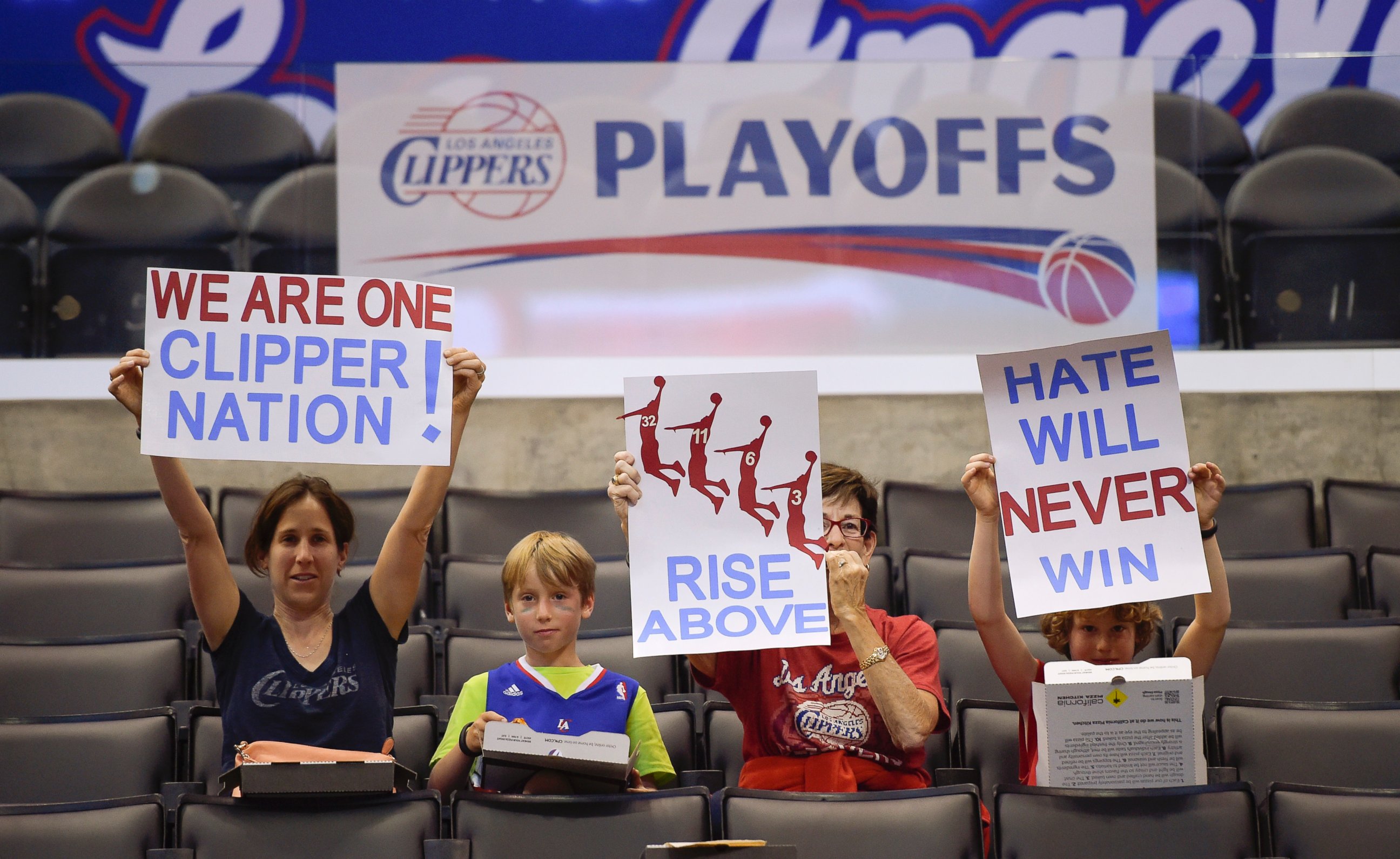 PHOTO: Fans hold up signs in support of the Los Angeles Clippers before Game 5 of an opening-round NBA basketball playoff series between the Clippers and the Golden State Warriors, April 29, 2014, in Los Angeles.