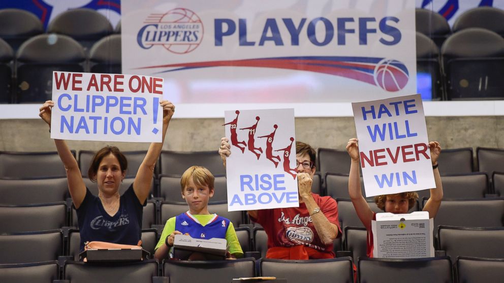 PHOTO: Fans hold up signs in support of the Los Angeles Clippers before Game 5 of an opening-round NBA basketball playoff series between the Clippers and the Golden State Warriors, April 29, 2014, in Los Angeles.