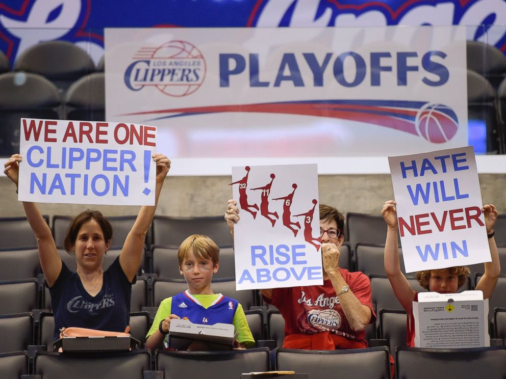 PHOTO: Fans hold up signs in support of the Los Angeles Clippers before Game 5 of an opening-round NBA basketball playoff series between the Clippers and the Golden State Warriors, April 29, 2014, in Los Angeles.