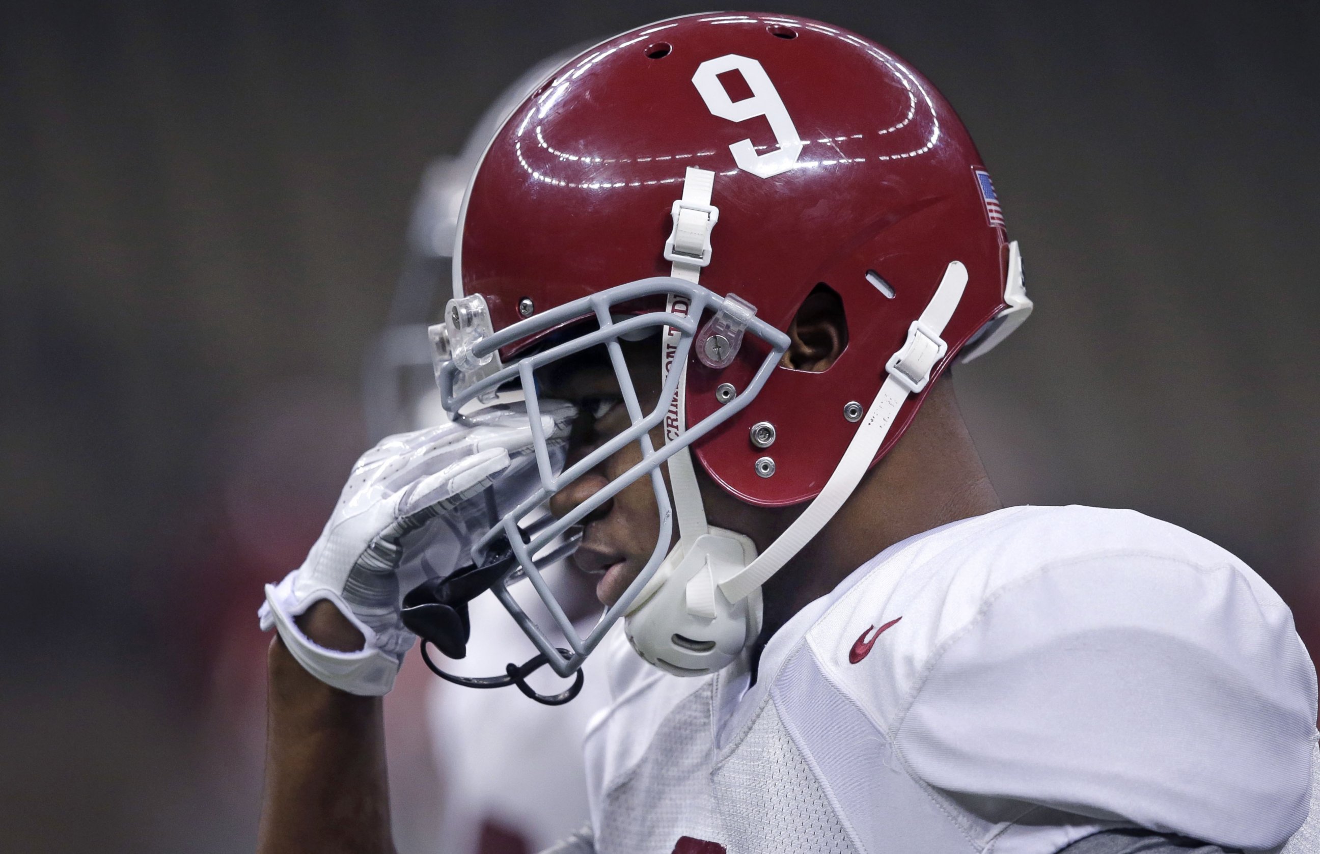 Alabama wide receiver Amari Cooper (9) wipes his brow during practice at the Mercedes-Benz Superdome in New Orleans, Monday, Dec. 29, 2014. They will square off against Ohio State in the Allstate Sugar Bowl NCAA football game on Jan. 1, 2015.