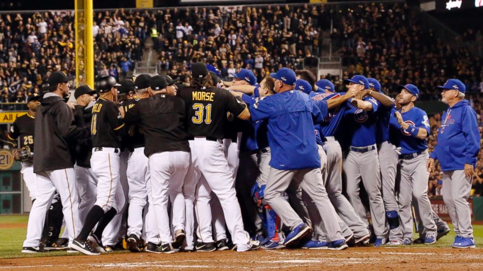 Both the Chicago Cubs and the Pittsburgh Pirates swarm the field after Cubs pitcher Jake Arrieta was hit by pitch by Pittsburgh Pirates relief pitcher Tony Watson in the seventh inning of the National League wild card baseball game, Wednesday, Oct. 7, 2015, in Pittsburgh.