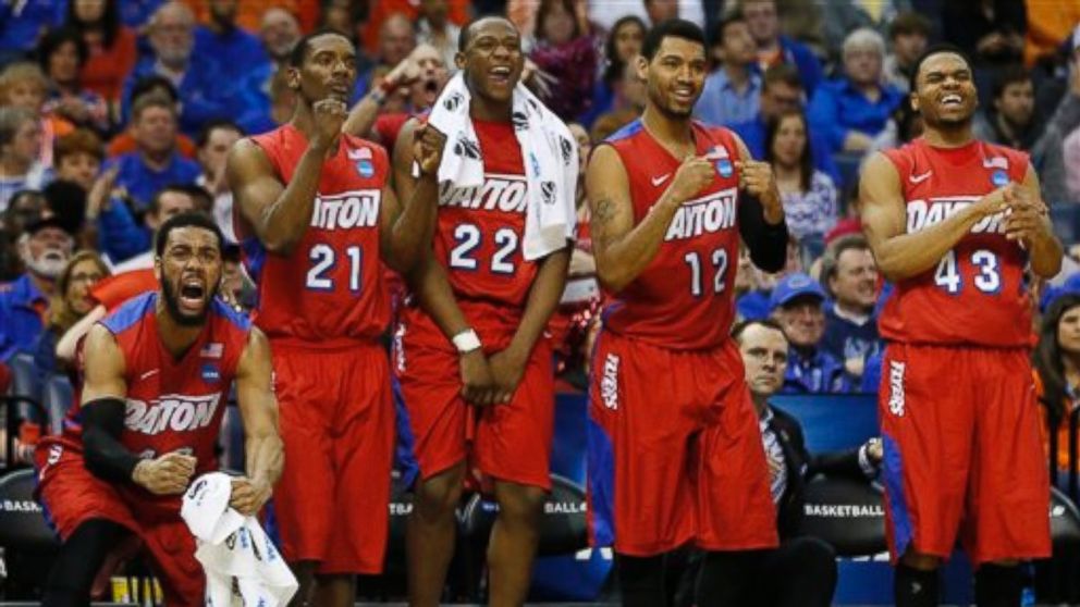 Dayton players celebrate a three-point shot against Stanford during the second half in a regional semifinal game at the NCAA college basketball tournament, Thursday, March 27, 2014, in Memphis, Tenn. Dayton won 82-72.