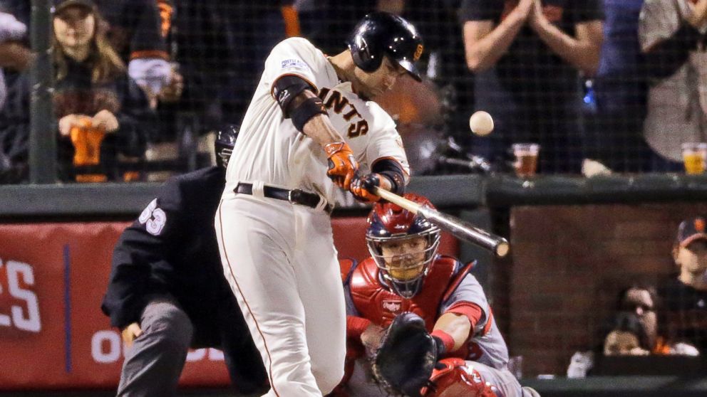 San Francisco Giants Travis Ishikawa hits a walk-off three-run home run during the ninth inning of Game 5 of the National League baseball championship series against the St. Louis Cardinals, Oct. 16, 2014, in San Francisco.