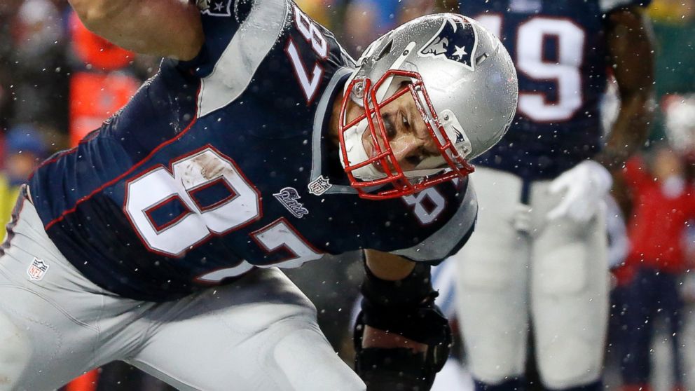 New England Patriots tight end Rob Gronkowski spikes the ball after catching a 5-yard touchdown pass during the second half of the NFL football AFC Championship game against the Indianapolis Colts, Jan. 18, 2015, in Foxborough, Mass.