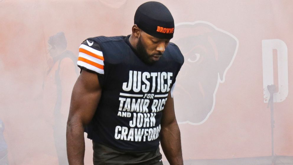 Cleveland Browns wide receiver Andrew Hawkins wears a shirt calling attention to two black Ohioans killed during encounters with law enforcement before an NFL football game against the Cincinnati Bengals in Cleveland, Dec. 14, 2014.