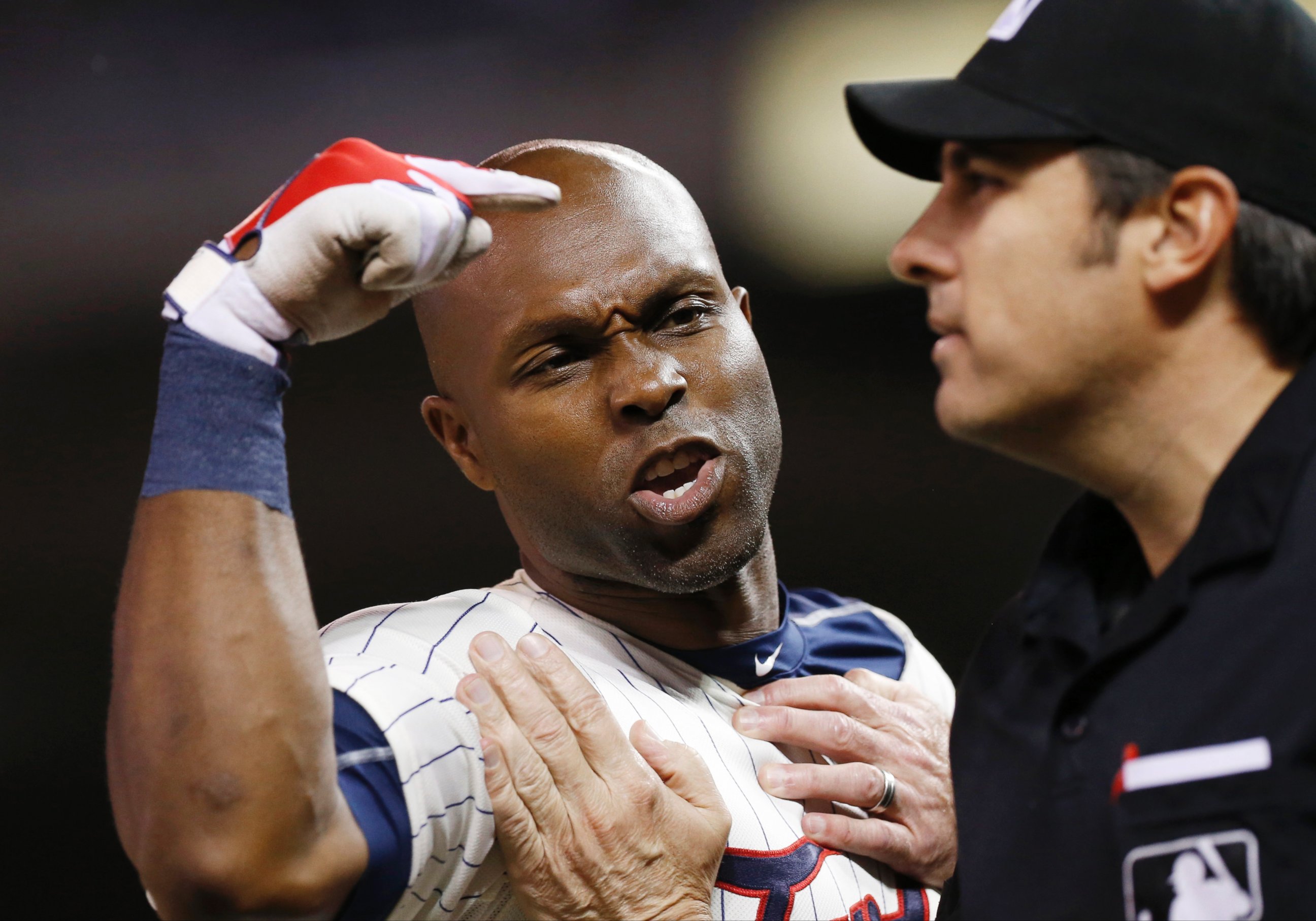 PHOTO: Umpire Jeff Kellogg restrains Minnesota Twins? Torii Hunter, left, who argues a call third strike after he was ejected by plate umpire Mark Ripperger during the eighth inning of a baseball game, June 10, 2015, in Minneapolis.