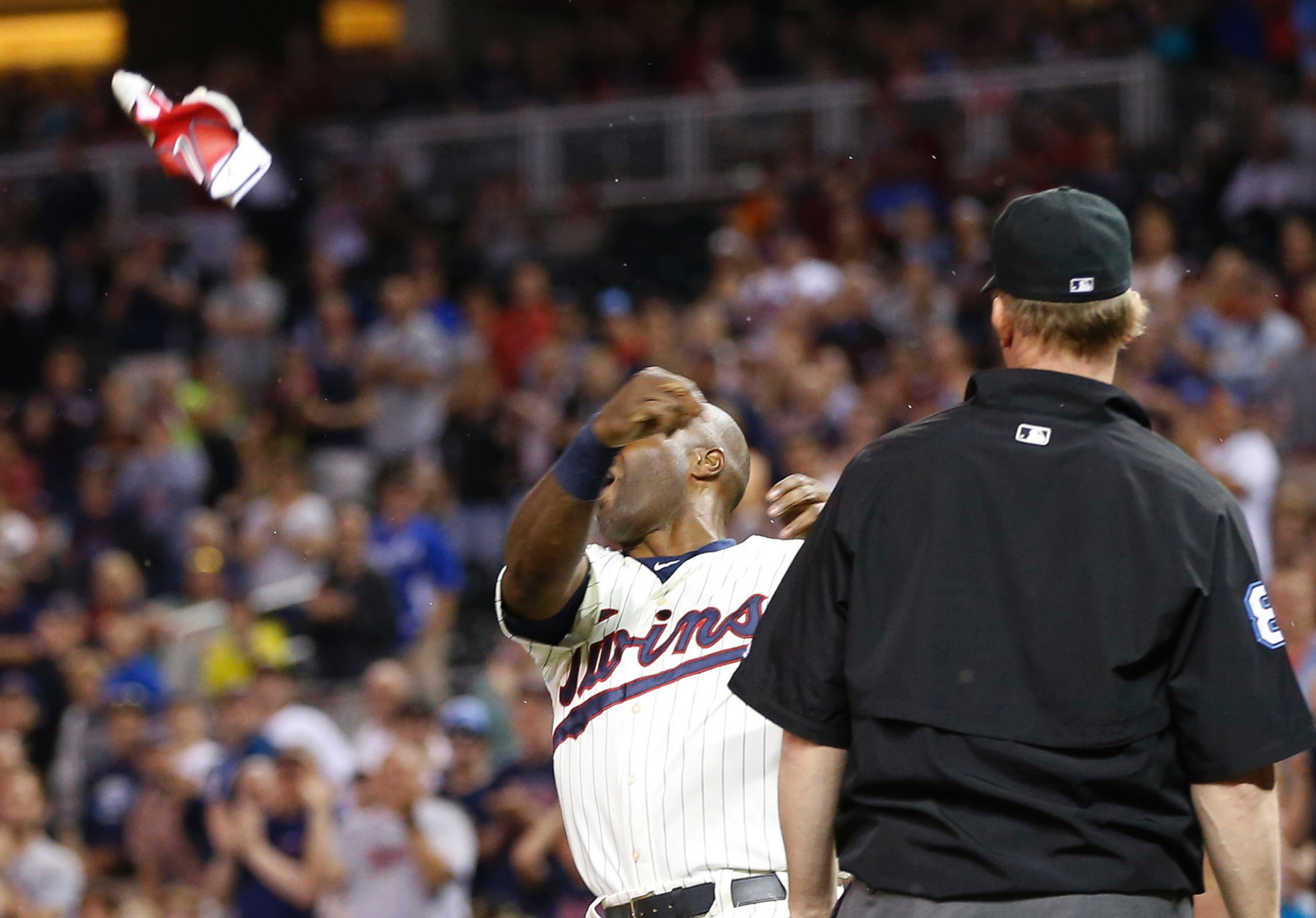 PHOTO: Minnesota Twins player Torii Hunter tosses his batting glove after he was ejected during the eighth inning of a baseball game against the Kansas City Royals, Wednesday, June 10, 2015, in Minneapolis.
