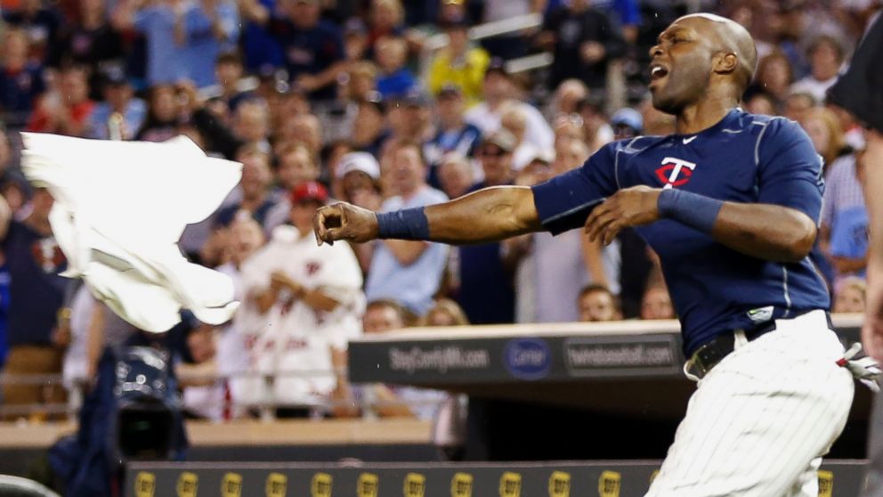 Minnesota Twins outfielder Torii Hunter tosses his jersey following his ejection after he was called out on strikes in the eighth inning of a baseball game against the Kansas City Royals, June 10, 2015, in Minneapolis.
