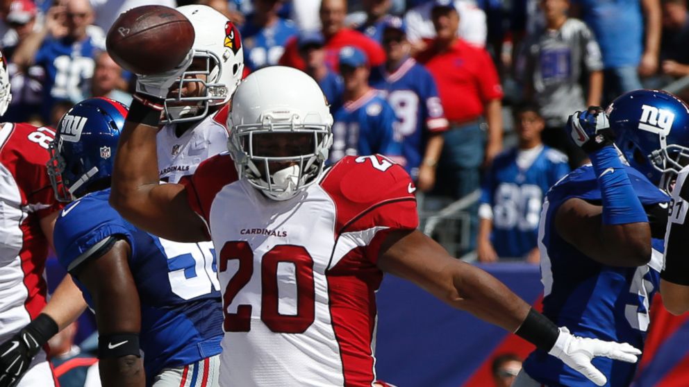 Arizona Cardinals running back Jonathan Dwyer (20) celebrates after scoring a touchdown during the first half of an NFL football game against the New York Giants on Sunday, Sept. 14, 2014, in East Rutherford, N.J.