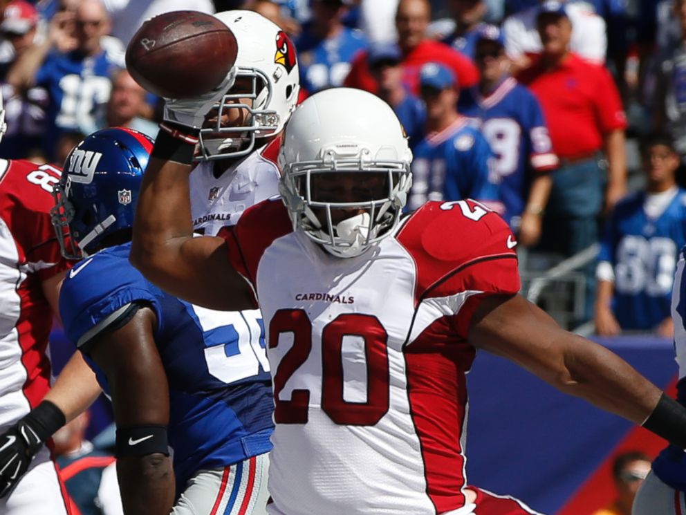 Arizona Cardinals running back Jonathan Dwyer (20) celebrates after scoring a touchdown during the first half of an NFL football game against the New York Giants on Sunday, Sept. 14, 2014, in East Rutherford, N.J.