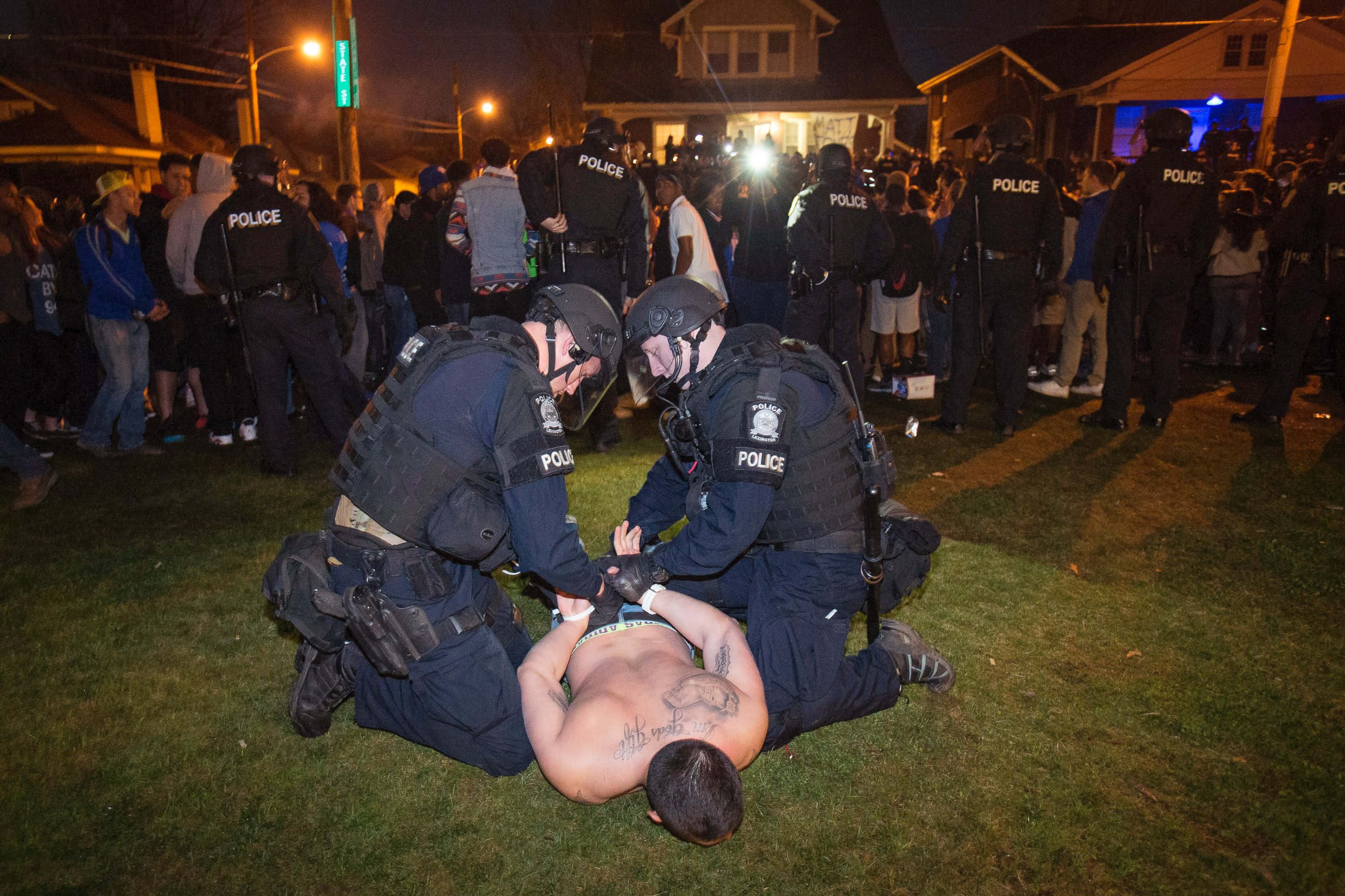 PHOTO:Police arrest a man as Kentucky fans gather near the University of Kentucky campus, Sunday, April 5, 2015, in Lexington, Ky.