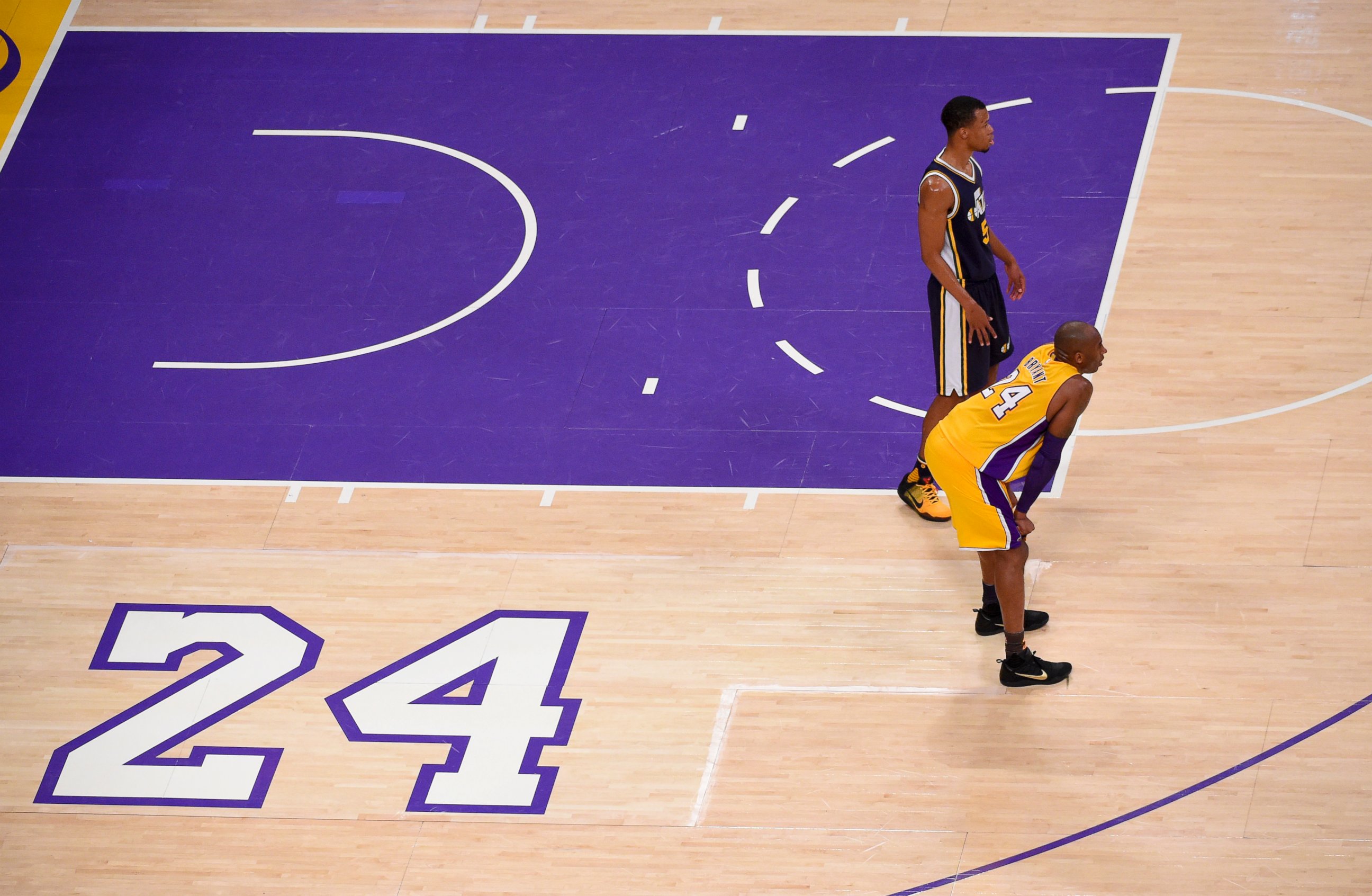 PHOTO: Los Angeles Lakers forward Kobe Bryant, foreground, and Utah Jazz guard Rodney Hood pause during the first half of Bryant's last NBA basketball game, April 13, 2016, in Los Angeles.