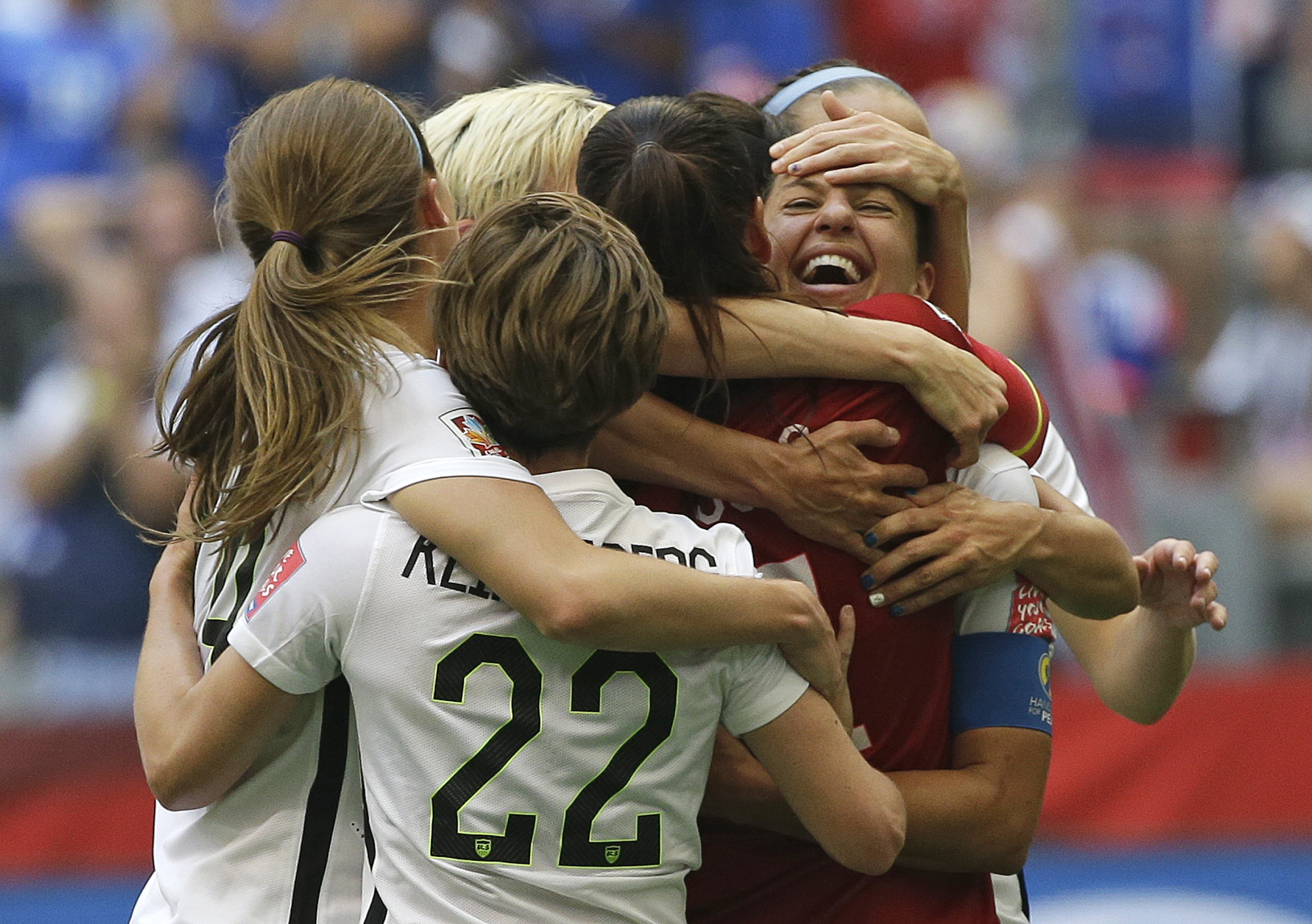 PHOTO: United States' Carli Lloyd, right, celebrates with teammates after Lloyd scored her third goal against Japan during the first half of the FIFA Women's World Cup soccer championship in Vancouver, British Columbia, Canada, July 5, 2015.
