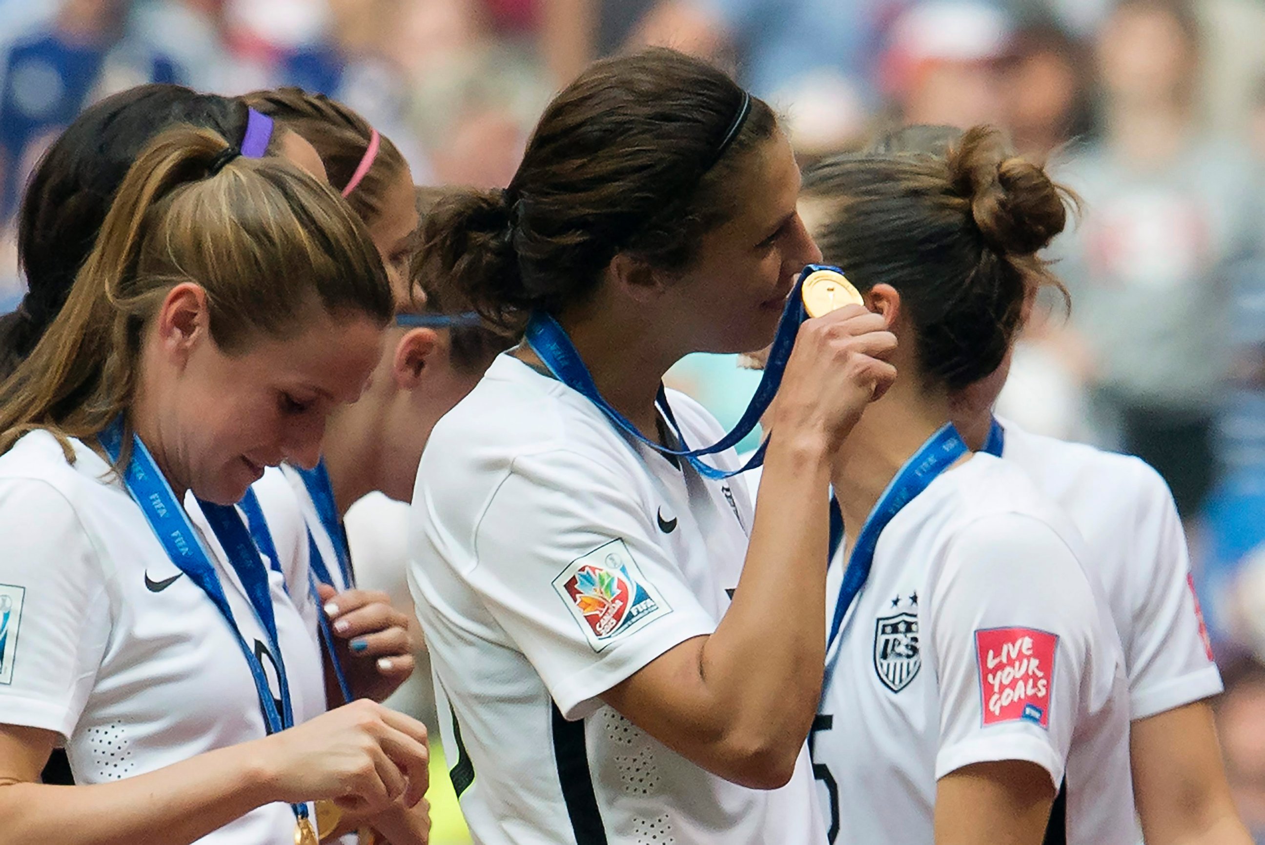 PHOTO: USA's Carli Lloyd holds her gold medal following the team's win over Japan at the Women's World Cup soccer championship in Vancouver, British Columbia, Canada, July 5, 2015.