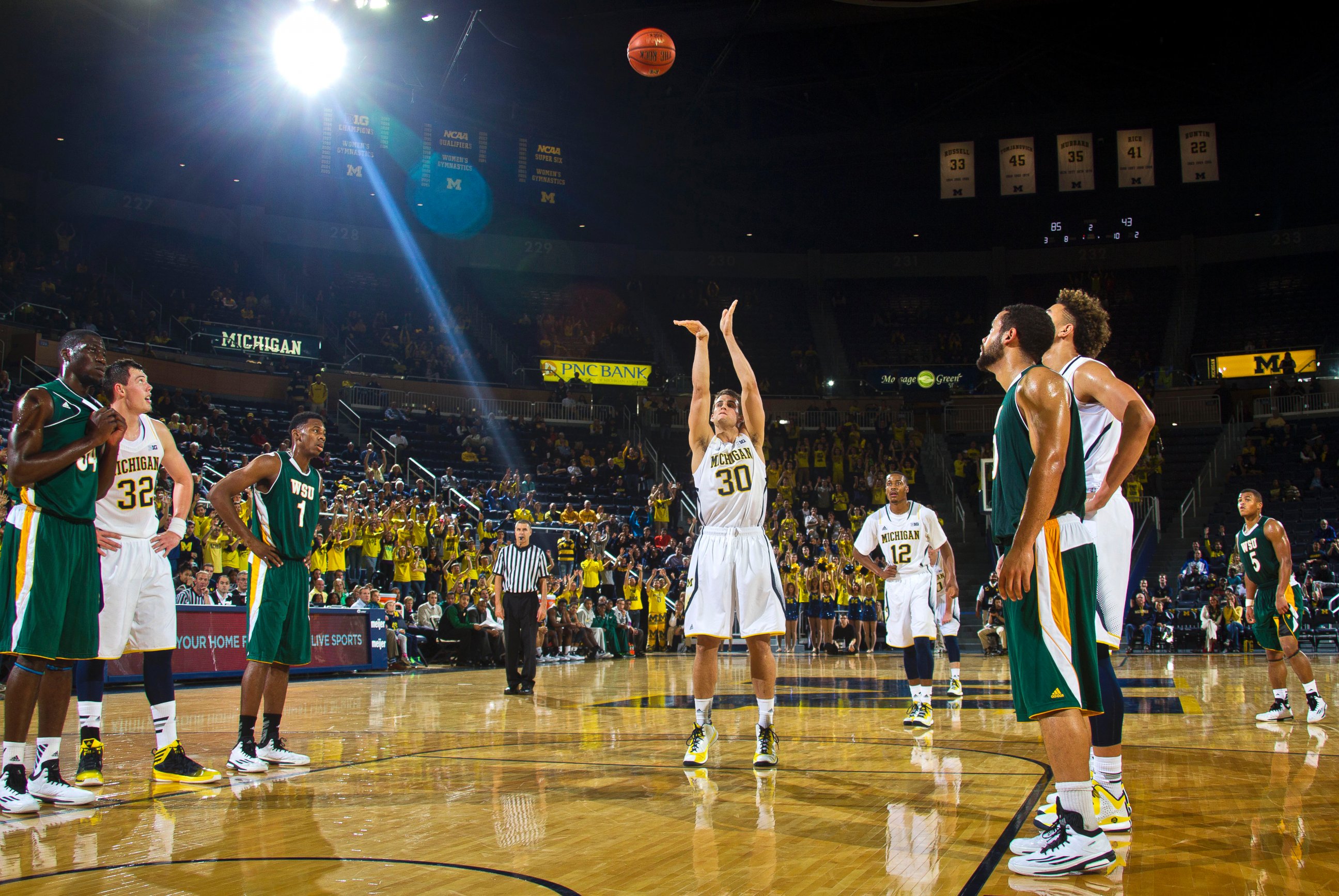 Michigan guard Austin Hatch makes a free throw in the second half of an NCAA college basketball exhibition game against Wayne State at Crisler Center in Ann Arbor, Mich., Nov. 10, 2014.