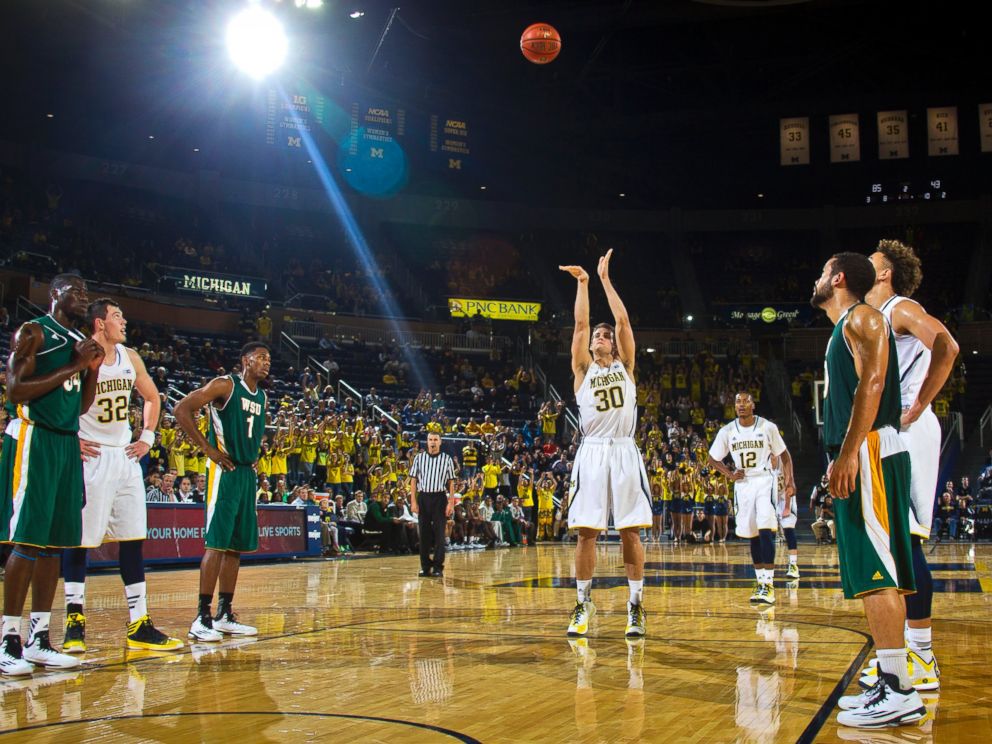 Michigan guard Austin Hatch makes a free throw in the second half of an NCAA college basketball exhibition game against Wayne State at Crisler Center in Ann Arbor, Mich., Nov. 10, 2014.