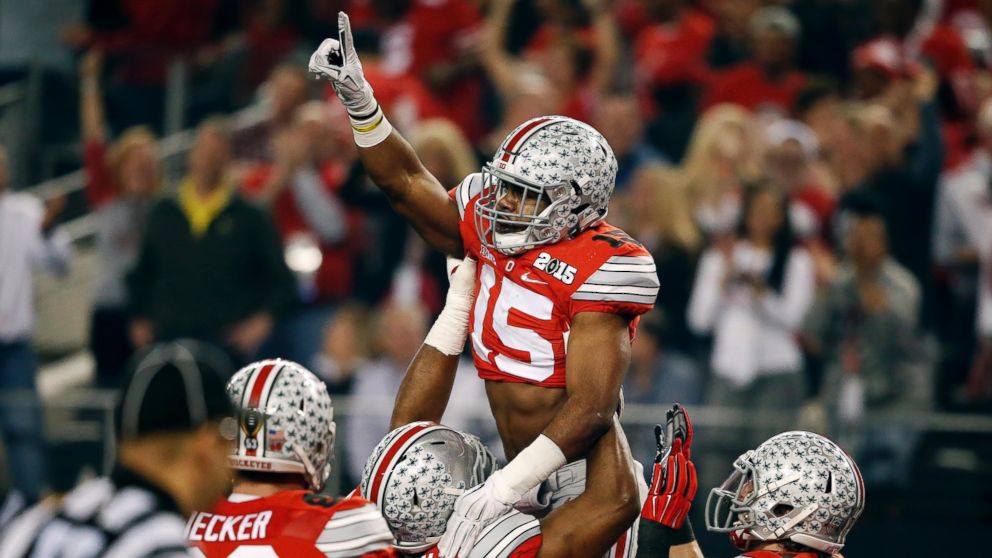 Ohio State's Ezekiel Elliott celebrates his touchdown run during the first half of the NCAA college football playoff championship game against Oregon, Jan. 12, 2015, in Arlington, Texas.