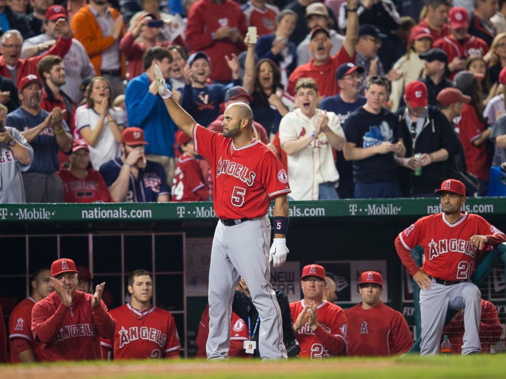PHOTO: Los Angeles Angels first baseman Albert Pujols acknowledges the applause from the crowd after hitting his 500th career home run, April 22, 2014.