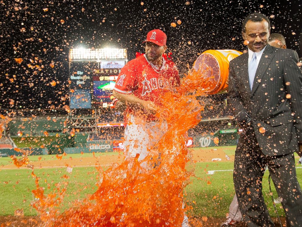 PHOTO: Los Angeles Angels Albert Pujols is showered with a buckle of Gatorade by his teammates during an on on-air interview, April 22, 2014 in Washington.