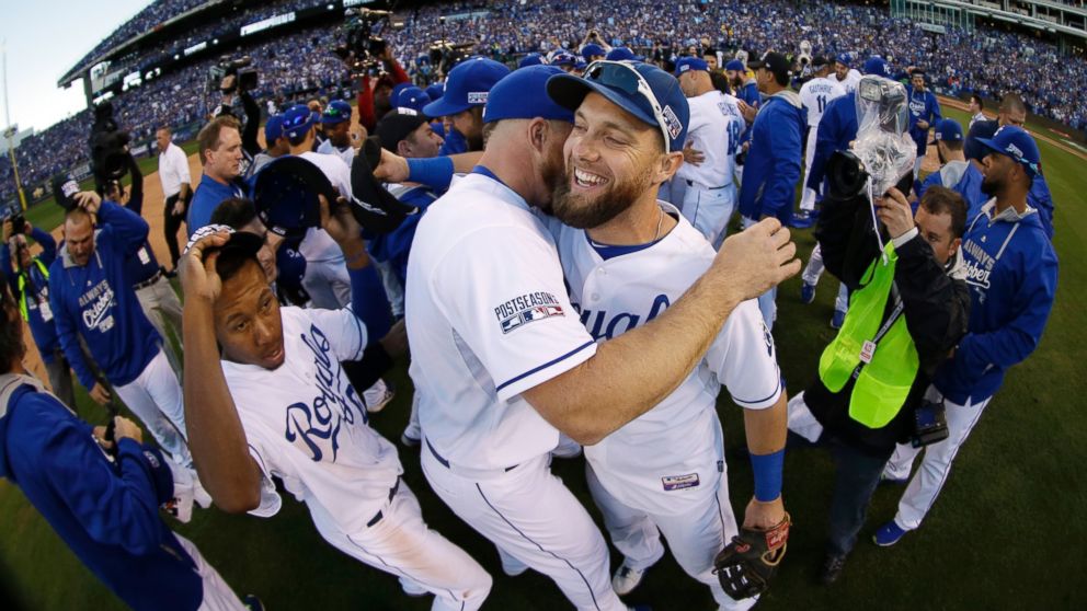 Kansas City Royals' Alex Gordon, right, celebrates with teammates after the Royals defeated the Baltimore Orioles to win the American League baseball championship series, Oct. 15, 2014, in Kansas City, Mo.