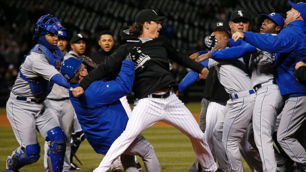 Chicago White Sox's Jeff Samardzija, center, fights with Kansas City Royals players during the seventh inning of a baseball game, April 23, 2015, in Chicago.